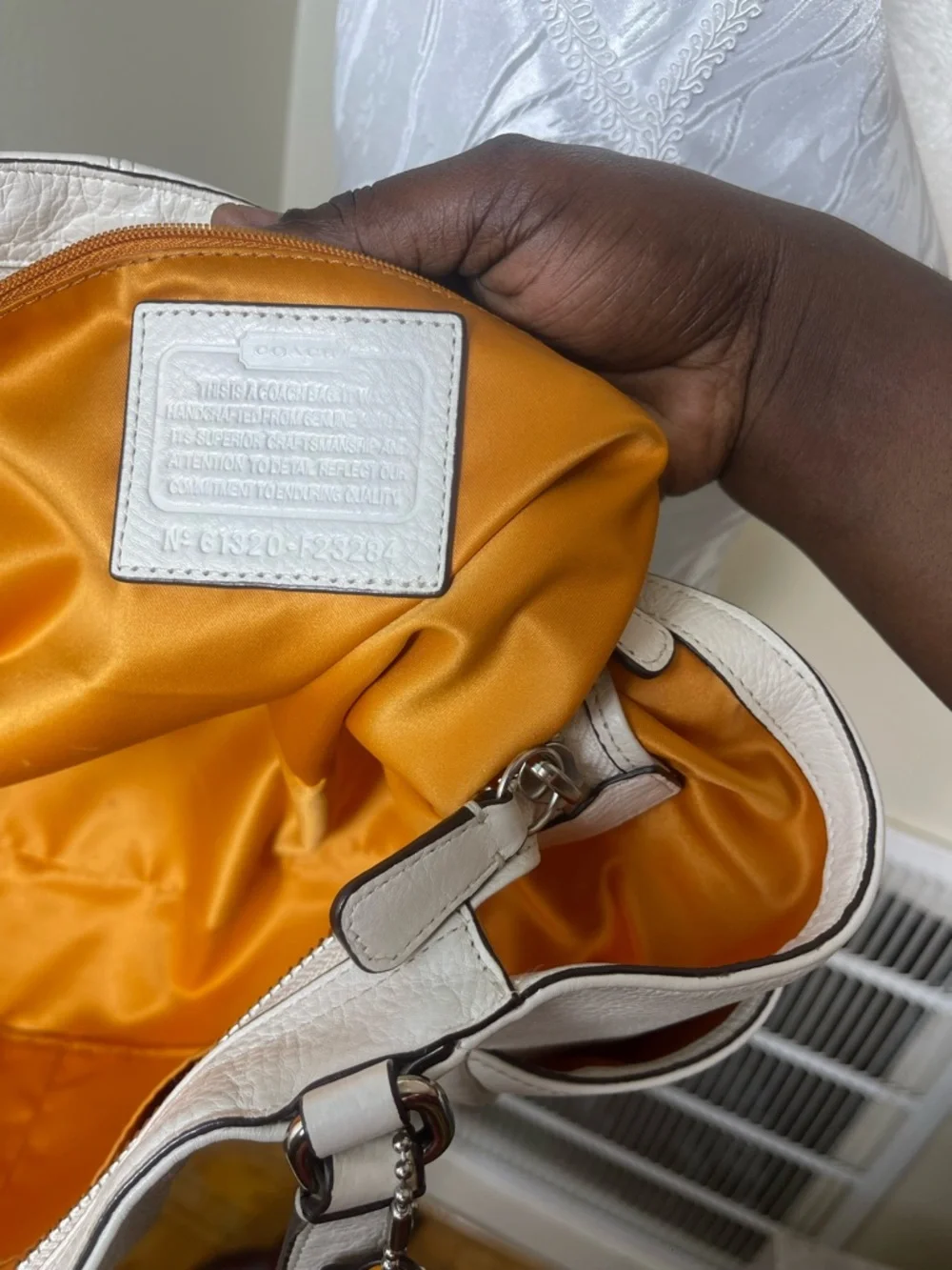 Coach White pebbled shoulder Leather Tote with Tan Accent Charm